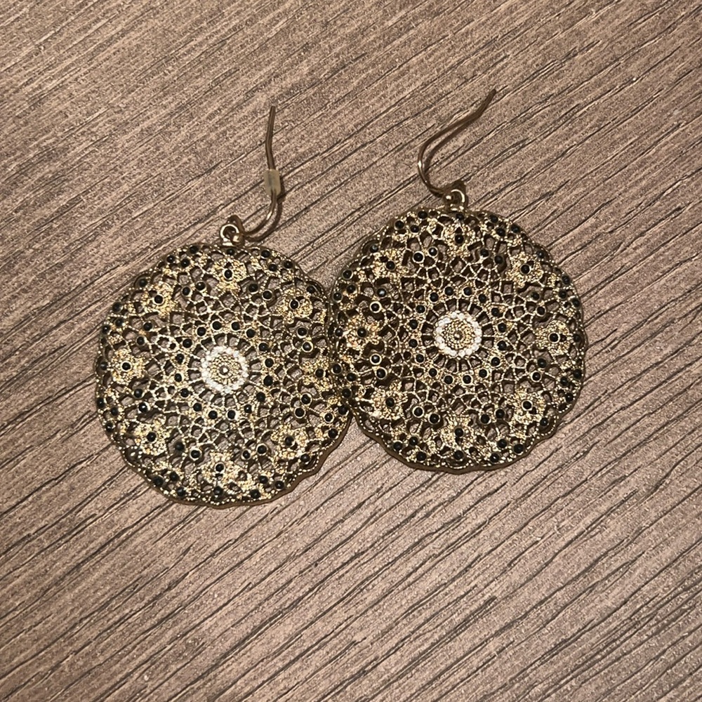 Gold circle earrings with black dots